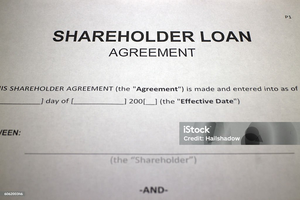 Someone filling out Shareholder Loan Agreement Form.