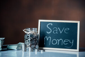 Bottles of cash with coins in saving money concept
